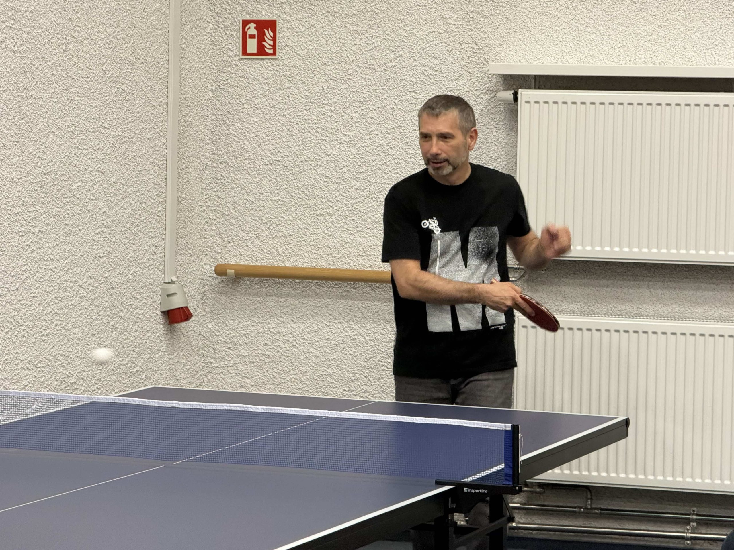 Michał playing table tennis